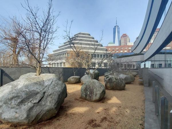 A Garden of Stones with Freedom Tower in background