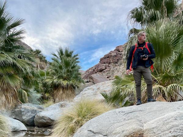 Michael Eason hiking in Anza-Borrego Desert State Park to observe Washingtonia filifera in situ