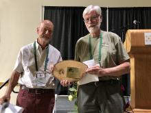 Shaun Haddock receives an award for Eike Jablonski